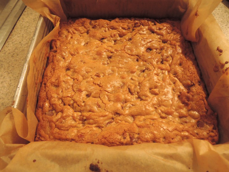 Lining the baking dish with parchment with ends overhanging, makes it easy to remove the blondies