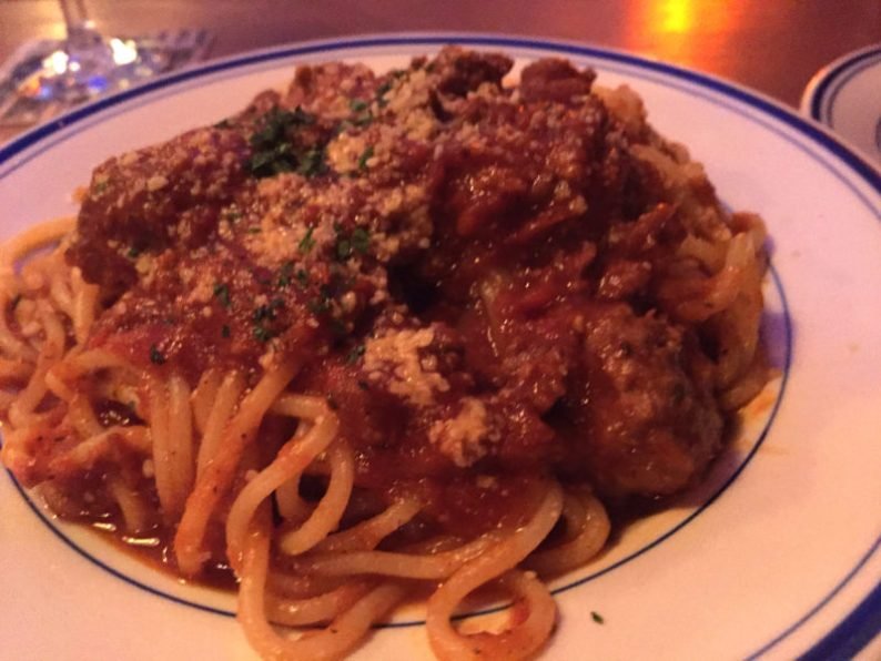 A small bowl of meatballs over the day's pasta, house-made spaghetti